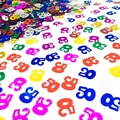 Close-up of colorful 50th birthday number confetti for anniversary table decoration - 15g/Pack / Colorful