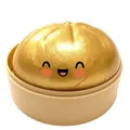 Simpatico baozi dorato sorridente giocattolo antistress in una base per vapore in plastica - Oro