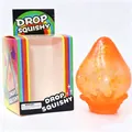 Détail du jouet squishy goutte pailletée orange avec sa boîte d'emballage arc-en-ciel - Orange