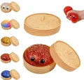Giocattolo squishy baozi rosso scintillante in un mini cestino a vapore antistress - Panino Simulato Con Vaporiera / Oro e Rosa