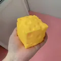 Realistic yellow square cheese squishy toy held in hand for stress relief and relaxation - Square Cheese - Flour Type / 7cm