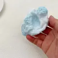 Close-up of blue and white textured handmade squishy stress relief toy being squeezed. - Ultra-thin Ice Crust Handmade Ball / Blue