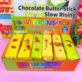 Een set langzaam rijzende boterstick squishy speelgoed in een kleurrijke doos - Chocolade Boterstaaf