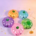 Close-up view of colorful glitter Halloween pumpkin squishy stress relief fidget toys - Random Color