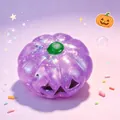 Close-up of glittery purple Halloween pumpkin squishy decompression toy with green stem - Purple