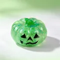 Translucent green Halloween pumpkin squishy toy with glitter and Jack-o'-lantern face - Green