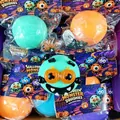 Detail view of colorful Halloween monster squishies set in festive retail packaging - Green Pumpkin Monster / Set of 4