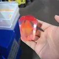 Macro detail of translucent red pomegranate seed squishy toy being held in hand - Pomegranate Flesh Style / Gradient Red (Pomegranate Squishy)