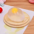 Juguete antiestrés con forma de huevo translúcido y diseño de yema en el interior - Estilo Yema de Huevo