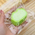 Cute green cat-shaped squishy toy in clear plastic packaging for stress relief and fun - Light Green