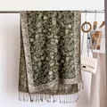 Close-up view of elegant paisley patterns and delicate fringes on a warm faux cashmere scarf - Army Green Style (WT328-8) / 190x69cm