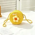 Close-up of yellow round handmade straw bag for girls with flower and Sweet embroidery - SWEET Yellow Flower / Yellow