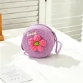 Macro view of purple woven straw bag for girls featuring a pink crochet flower accent - SWEET Pink Flower / Purple