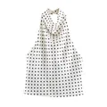 Detailed view of a elegant white satin halter neck top with classic black polka dots - XS / Tops / Beige Polka Dot