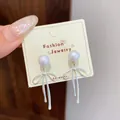 Matte silver bow tassel earrings with pearl studs on a display card, SKU detail view. - Evening Gown Bowknot Artificial Pearl