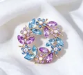 Close-up detail of vintage crystal wreath brooch featuring purple and blue rhinestones. - Wreath Brooch / 4CM Diameter / Purple