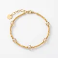 Pulsera vintage de cuentas doradas con cristales champagne y cadena ajustable de cierre. - Estilo de cuenta tallada marrón claro