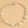 Close-up view of an elegant baroque irregular pearl necklace with silver-tone beads. - Silver Baroque Pearl Necklace (S314)