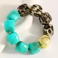Close-up detail of irregular resin beaded bracelet with leopard print and turquoise beads - Blue-Green (DZ-694)