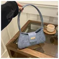 Stylish vintage light blue suede baguette underarm bag featuring a golden metallic clasp detail - Blue