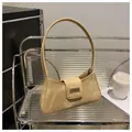Elegant retro tan suede-textured baguette underarm bag with a sleek metal buckle closure - Khaki