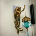 Vintage golden mermaid wall lamp featuring a blue glass lantern with elegant pearl drops - Mermaid Wall Lamp