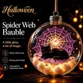 Glowing Halloween bauble featuring a sleeping black cat on a purple spider web - Black Cat Spider Web