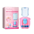 Close-up view of Dowmoo pink mini water dispenser toy for kids with retail packaging box - Pink Piggy Style / 1 Piece
