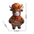 Vista dettagliata di una statuetta di mucca Highland con dimensioni e segno di ringraziamento - Mucca del Ringraziamento B