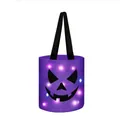 LED Halloween pumpkin candy bucket in purple with glowing jack-o-lantern face print. - Halloween Candy Bucket Style / Purple