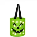 Detail of the green Halloween candy bucket featuring glowing LED lights and pumpkin face - Halloween Candy Bucket Style / Green