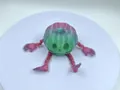 Detailliertes 3D-gedrucktes gelenkiges Kürbis-Monster-Spielzeug in Lila-Grün-Verlauf - Kürbis Böse / Rosa und Grün