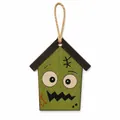 Detailed macro shot of a green wooden Halloween house ornament with a quirky monster face - Green Monster House A / Style B