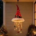Detail showing lighted Santa hat with hanging warm LED strings and festive tiny ornaments - Red Sequin Style (D)