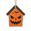 Close-up detail of Halloween wooden house ornament with pumpkin face and bat designs. - Pumpkin House / Style C