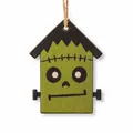 Detailed macro view of a wooden Frankenstein house ornament for Halloween decor. - Style F