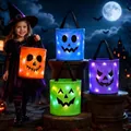 Detailed view of LED glow-in-the-dark Halloween candy baskets in four colors - Four-Piece Set