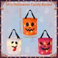 Detailed view of 3Pcs glowing Halloween candy buckets in orange, white, and pink colors. - 3-Piece Set B