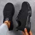 Close-up view of black breathable fly knit sneakers featuring a trendy chunky sole - 36 / Black
