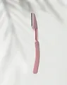 Maquinilla de afeitar de cejas plegable profesional en rosa para un aseo de precisión - Cuchilla de cejas / Rosa