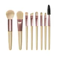 Vista dettagliata di un set di 8 pennelli per il trucco professionale con ghiere in oro rosa - Set da 8 pezzi / Giallo chiaro