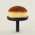 Close-up view of a soft domed nail dust brush featuring an ergonomic black ring handle - Single Stem / Black
