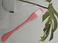 Close-up of pink dual-use facial mask brush and spatula with soft white fiber bristles - Dual-End Style / Bulk Packaging / Pink