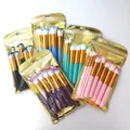 Multiple sets of 10-piece candy-colored makeup brushes in gold zipper packaging. - 10-Piece Set / Blue