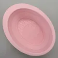 Bol de silicona rosa para limpieza de brochas de maquillaje con fondo texturizado - Bol de Limpieza de Silicona / Rosa