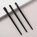 Detail view of three precision eyeliner and eye detail makeup brushes with black handles - 3-Piece Black Blade Set