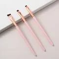 Detail view of three pink precision makeup brushes for eyeliner, concealer and shadow - 3-Piece Pink Blade Set