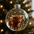 Clear crystal glass Christmas ornament with miniature Highland cow and gold stars - Highland Cow