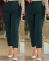 Detail view of slim fit dark green cropped dress pants with a high waist and pleated front. - Dark Green