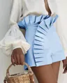 Detail shot of light blue high-waisted shorts featuring elegant pleated ruffles - S / Bottoms / Sky Blue